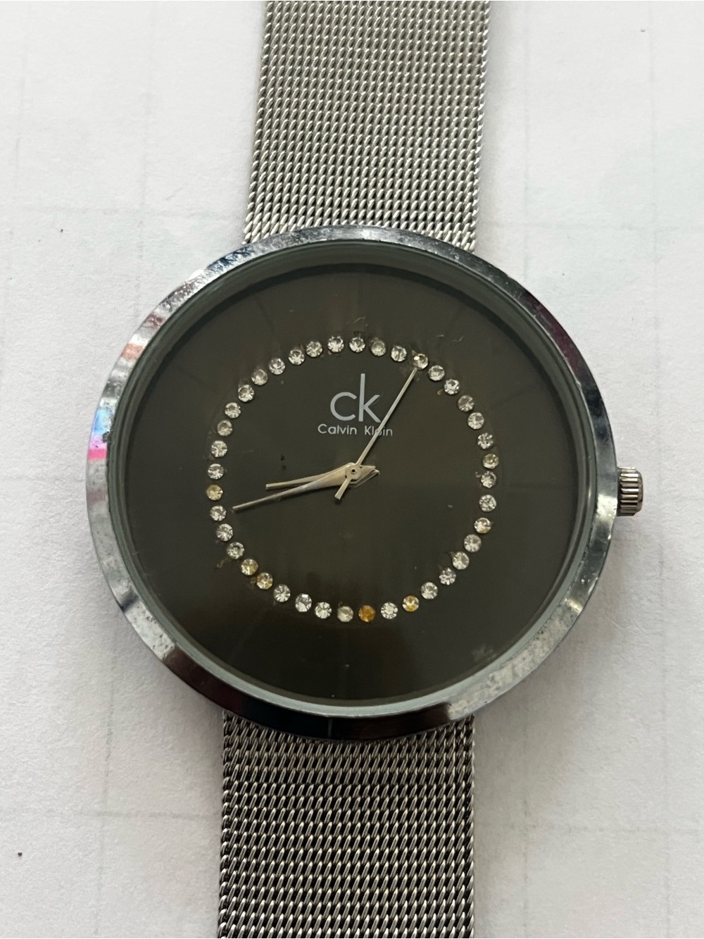 Calvin Klein Silver Mesh Bracelet Watch with Black Dial and Crystal Ring